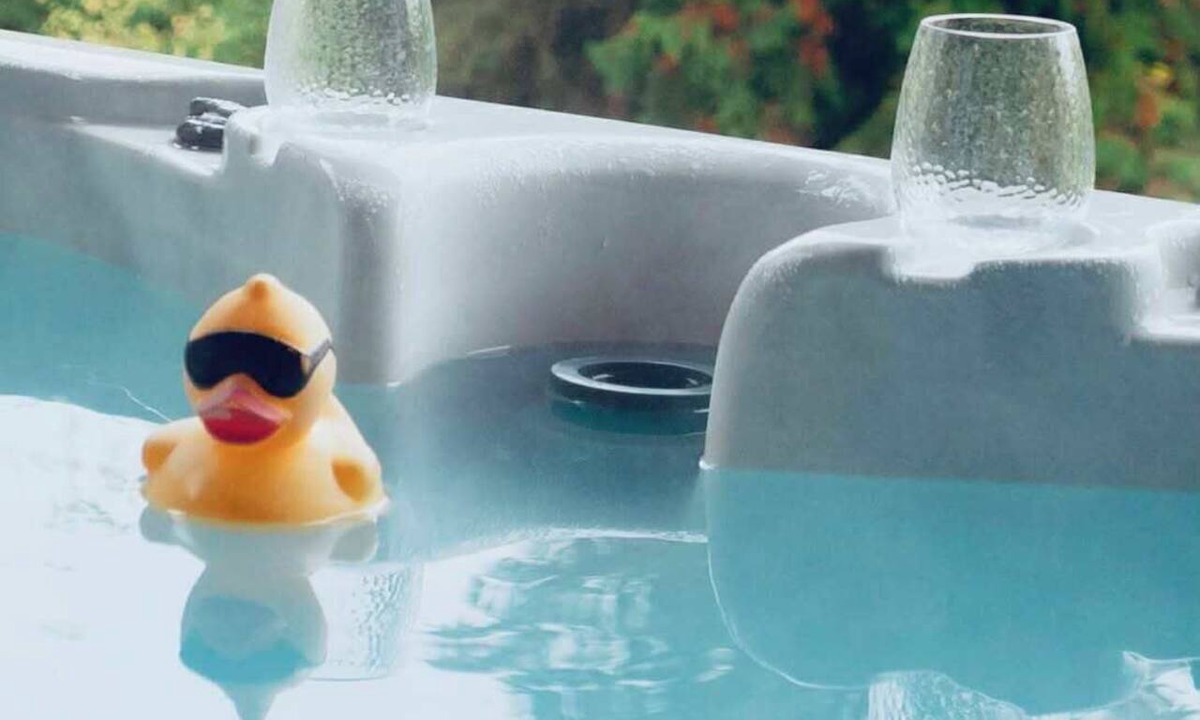 Eagle Bay House | A relaxing lake view at Eagle Bay Manor suite and hot tub