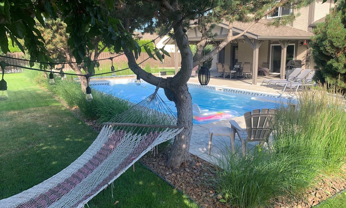 Crawford House | Family Vacation Oasis: Heated Pool, 5 bedrooms, 1/2 acre property, covered patio