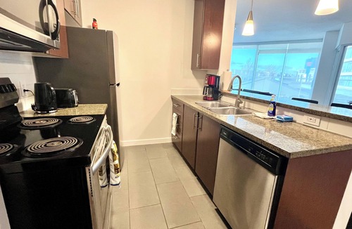 Crosstown Apartment | 2BR+Sofabed, 2Bath, Private 500sqft sundeck, EV Parking w/Pool, Sauna, Hot Tub