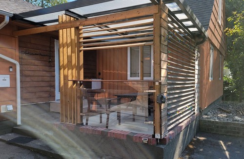 Burnaby House | 8 minute walk to skytrain Central Great covered outdoor seating with fire table.