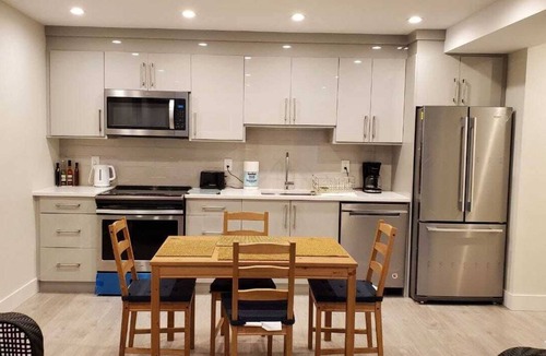 Canyon Heights House | Basement legal suite with 2 beds and 1 full bathroom with laundry and kitchen