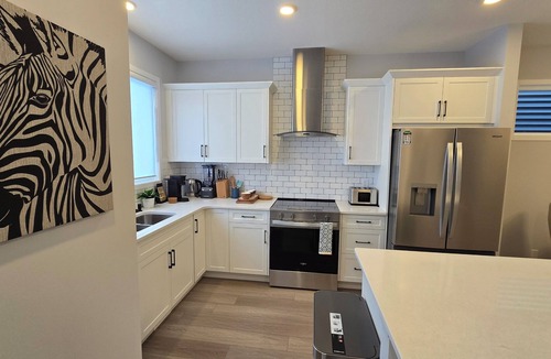Southwest Calgary House | Brand new 4-Brm + Den main floor unit in quiet community. Sleeps up to 10.