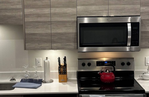 Vernon Condo | Contemporary studio retreat steps to the beach on Okanagan Lake.