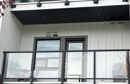 Vernon Condo | Contemporary studio retreat steps to the beach on Okanagan Lake.