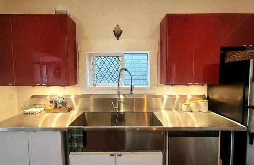 East Side House | Design Heritage Suite | Brick + Private Patio near Commercial Drive