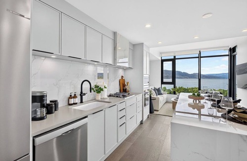 South Pandosy Condo | Experience luxury lakefront living at AQUA Kelowna. This elegant 1-bed retreat features a king suite & soa bed, spa-inspired bath, designer kitchen, and private patio with stunning Okanagan Lake views, plus resort pool/gym access.