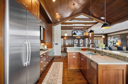 Southwest Edmonton House | Fortunato means "the fortunate one." This former Full House Lottery Dream Home has a private theatre, spa bathroom with soaker tub & heated towel drawer, a wine room, double sided fireplace & a full bar. Lodge luxury in Windermere.