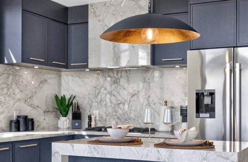 South Pandosy Condo | Luxury 2BR waterfront condo at AQUA Kelowna with a king suite, queen bedroom, private BBQ patio, high end designer interiors, quartz counters, custom navy cabinetry, premium appliances & steps from Okanagan Lake.