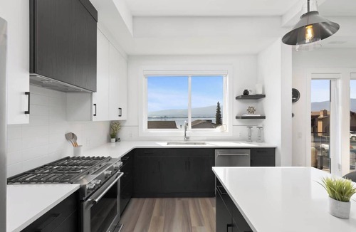 Central Okanagan House | Luxury 4-bed, 3.5-bath home in Shelter Bay, West K, rooftop deck with hot tub.