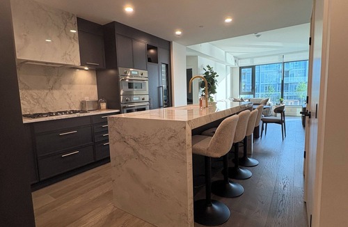 South Pandosy Condo | Luxury Lakefront Retreat | Beach, Pool, Hot Tub & Stunning Sunsets