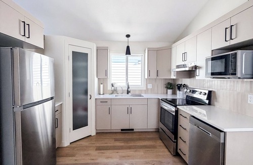 Grande Prairie House | Modern 4BR | Walk to Eastlink | Sleeps 8