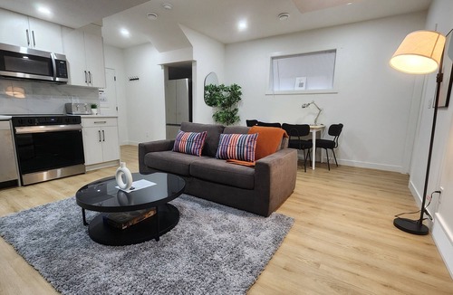 Southeast Calgary Apartment | Modern Suite in Seton - King Bed, 85" TV, Near South Health Campus & YMCA