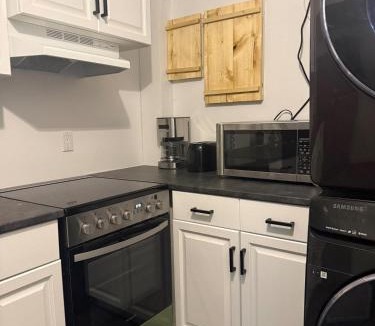 Hinton Apartment | Modern Upper Basement Theatre Suite of Hinton!