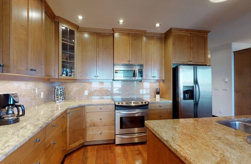 Big White Ski Resort Condo | Ski-in/out condo w/private hot tub, gas fireplace, & steam shower - mtn views