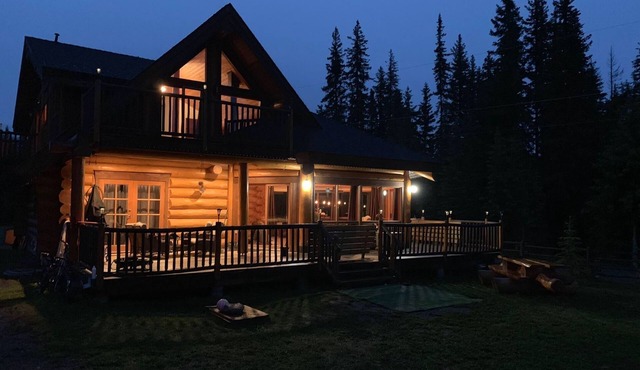 Custom built log home surrounded by lakes