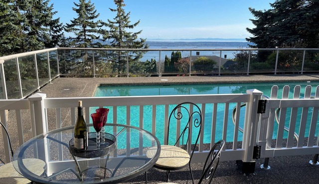 — Enjoy the oceanview poolside home in British Property