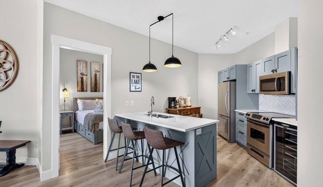 Escape to The Cove Lakeside Resort in this beautifully renovated ground-floor 2-bed, 2-bath condo. Features a huge walk-out patio with a private gate, cozy outdoor seating, and direct access to the pool, beach, marina, and waterfront trails.