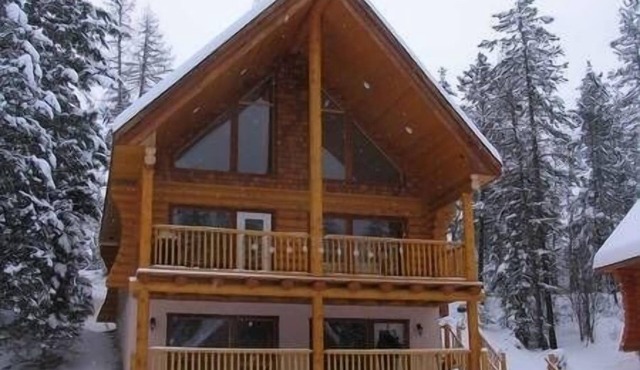 Log cabin in the woods surrounded by river and nature trails