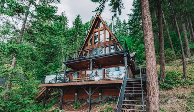 New** Bayside Estate: A quaint and cozy A-frame cabin nestled among the trees.