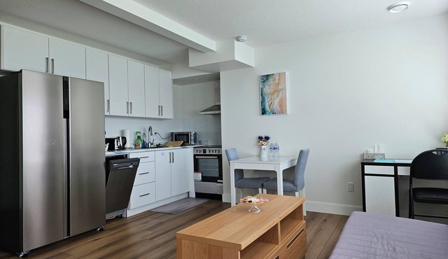 Private south-facing suite with a full bathroom and fully equipped kitchen.