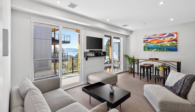 Welcome to Zara at Lakestone! A premier lakeside community for a peaceful escape with pickleball courts, a gym, and a sauna. Modern 1BR condo with lake & mountain views, private patio seating.