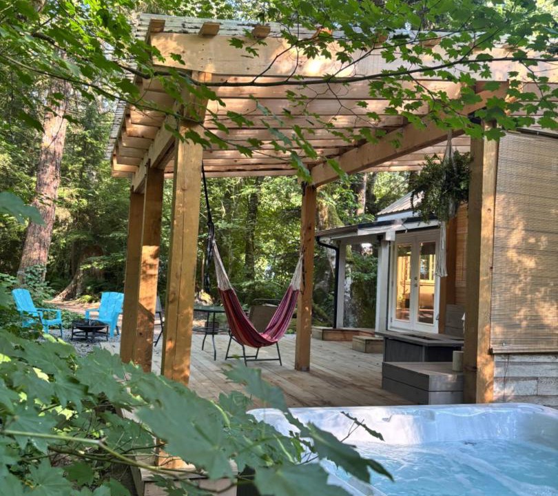 Woodfibre House | Riverwood Retreat-hot tub and cedar sauna on the river