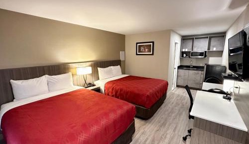 Efficiency Quadruple Room with Two Queen Beds - Non Smoking