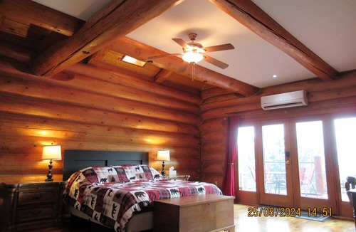 Central Okanagan Apartment | Log Castle In The Trees, minutes from airport, big city, lake & mountain views!