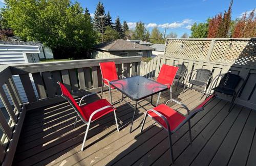 Southeast Calgary Villa | Executive family Relax House New AC 4Bed rooms 4Queen Beds plus Kids play rooms Large Deck Private Backyard 19 minutes YYC Walk to C Train Free BANFF PARK PASS