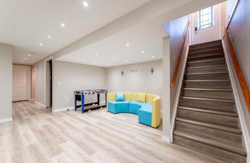 Southeast Calgary Villa | Executive family Relax House New AC 4Bed rooms 4Queen Beds plus Kids play rooms Large Deck Private Backyard 19 minutes YYC Walk to C Train Free BANFF PARK PASS